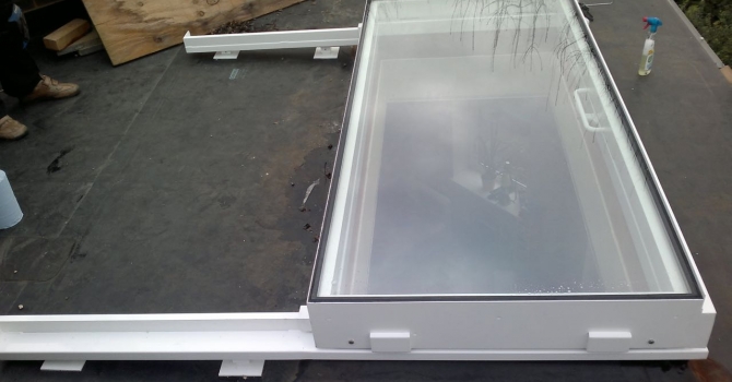 Manual sliding access rooflight